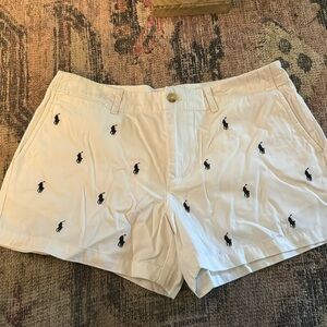 White polo with navy horses.